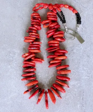 Bamboo Coral Disc Graduated Necklace with Sterling Silver Discs, Black Indonesian Glass Rondelles, Bamboo Coral Ovals, and a Sterling Silver Toggle Clasp