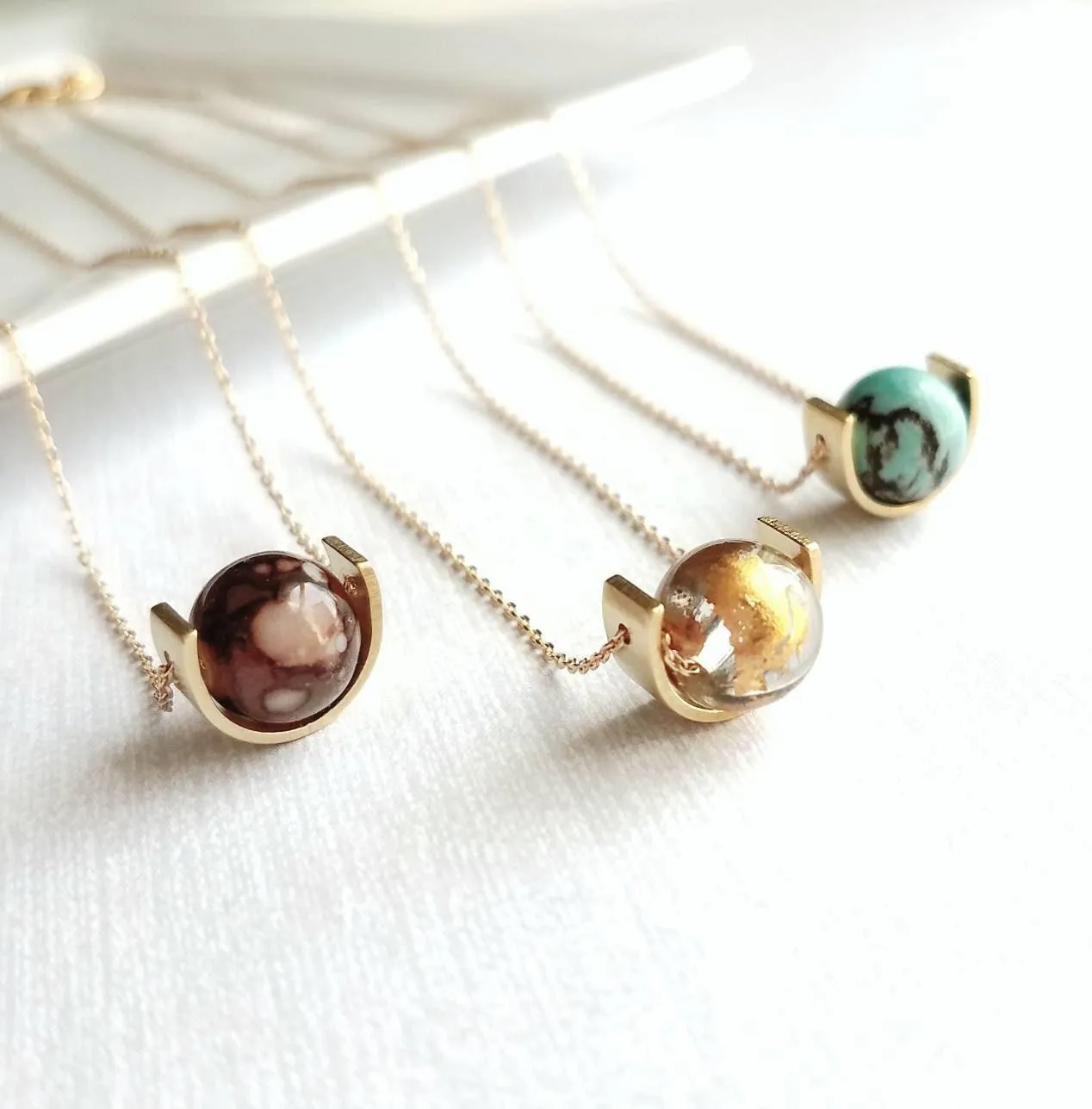 Gold Eclipse Necklace, turquoise blue stone, howlite necklace, brown black veining, round gemstone necklace, gold semicircle pendant, modern