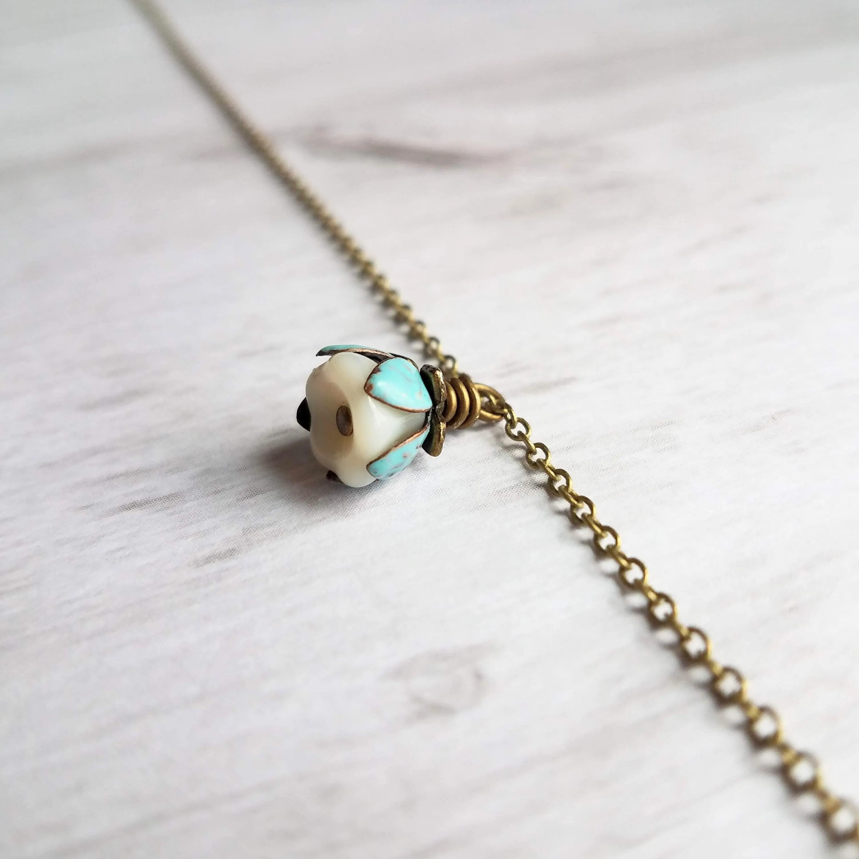Little Flower Necklace - delicate boho blossom pendant in vanilla cream - mint aqua patina leaves - thin fine antique brass/bronze chain