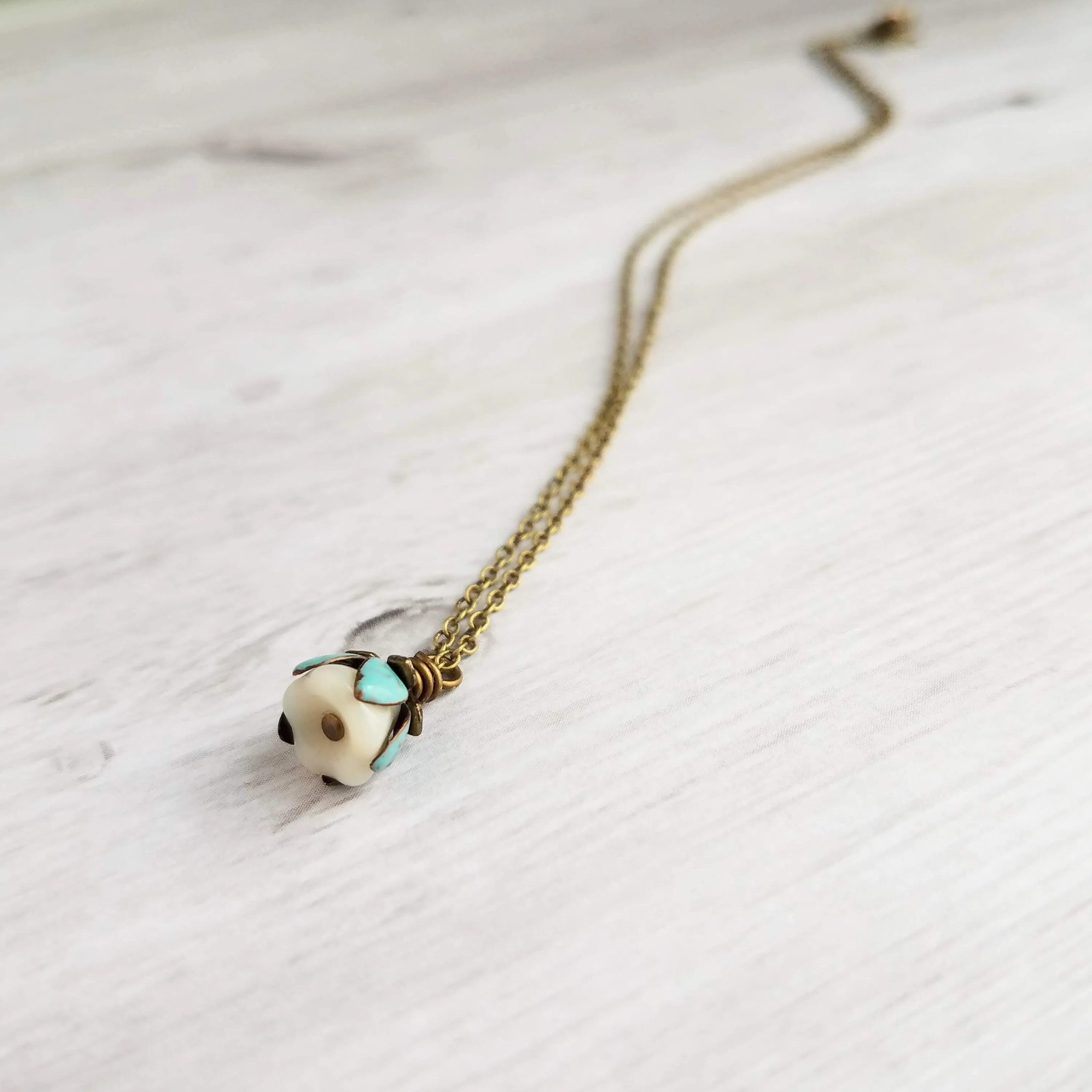 Little Flower Necklace - delicate boho blossom pendant in vanilla cream - mint aqua patina leaves - thin fine antique brass/bronze chain