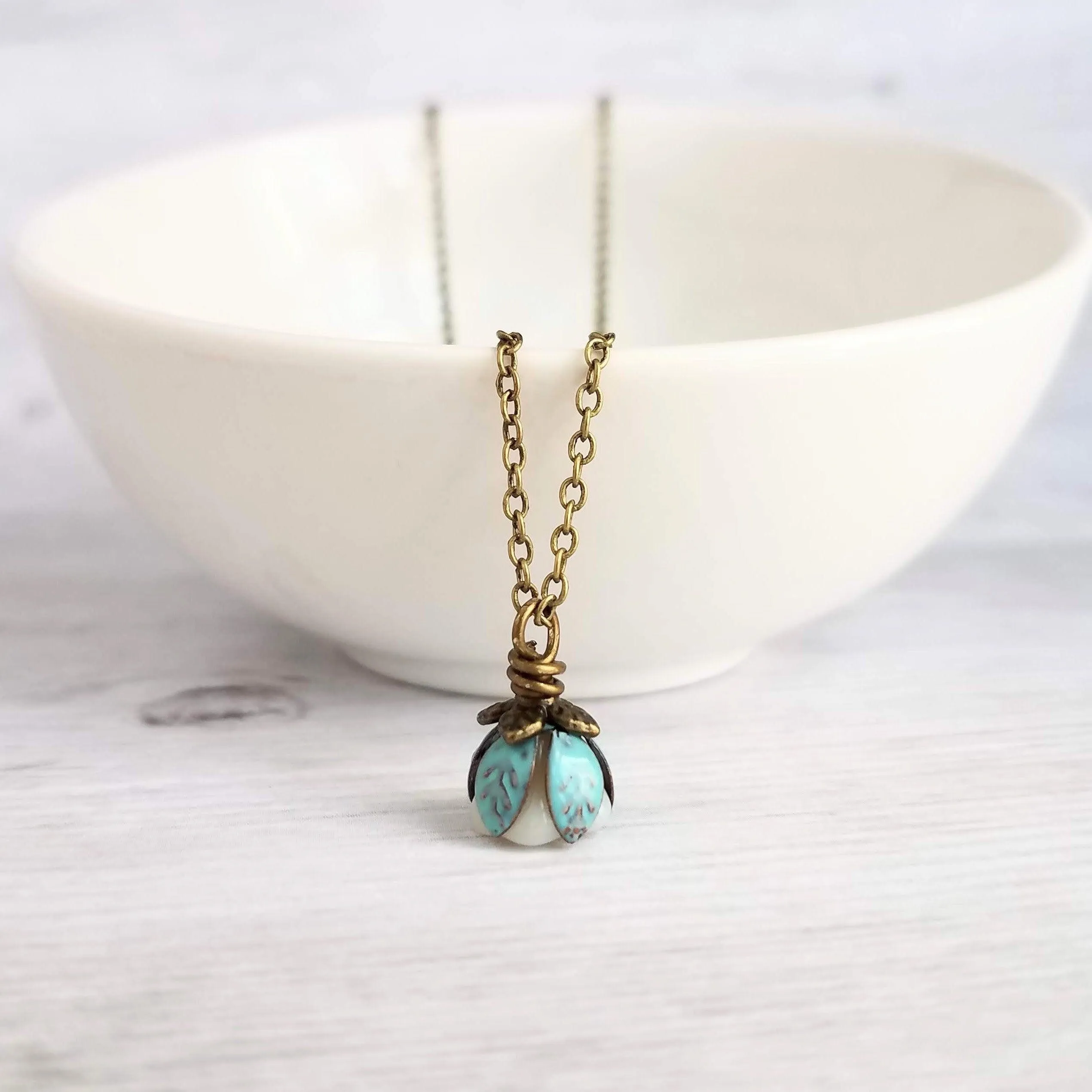 Little Flower Necklace - delicate boho blossom pendant in vanilla cream - mint aqua patina leaves - thin fine antique brass/bronze chain