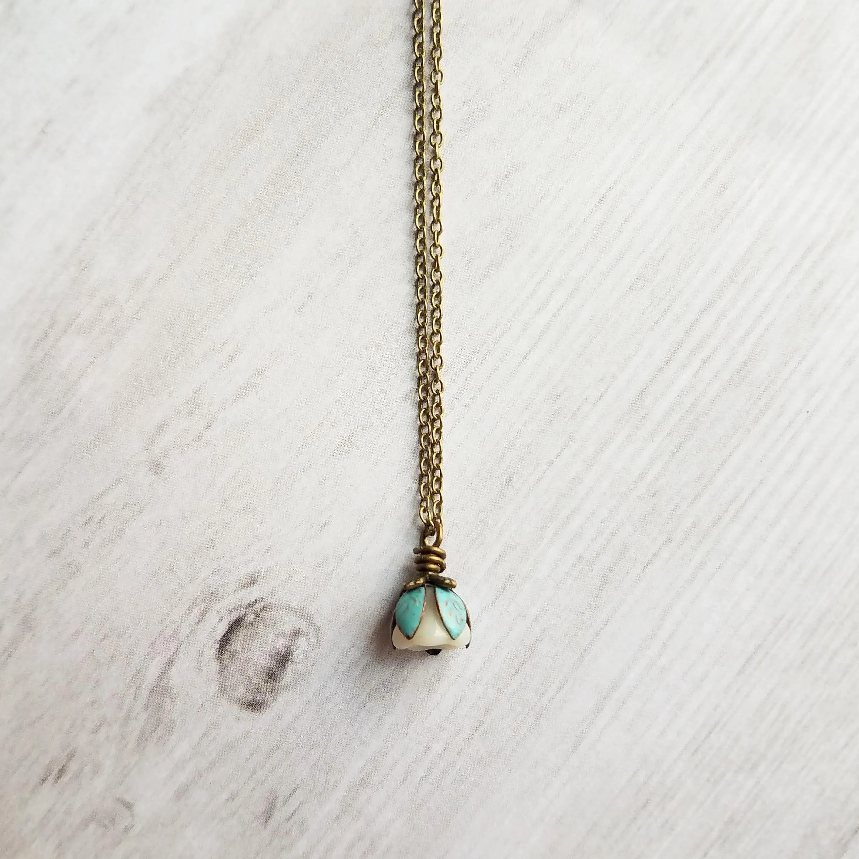 Little Flower Necklace - delicate boho blossom pendant in vanilla cream - mint aqua patina leaves - thin fine antique brass/bronze chain